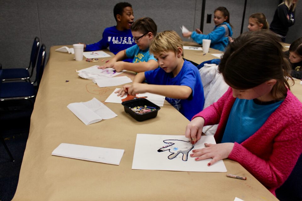 Children painting and drawing.